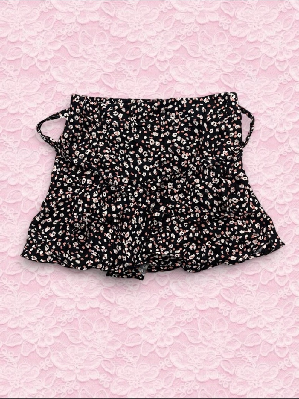 Black mini skirt with white floral print attached tie belt